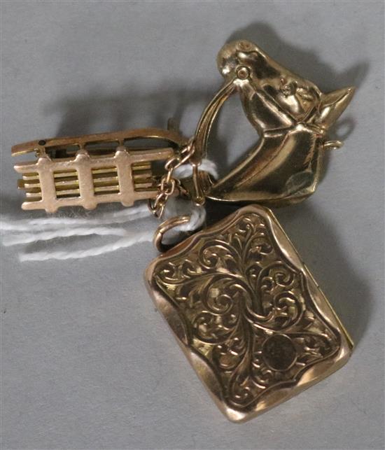 A 9ct gold Horse head charm, a yellow metal sleigh charm and a gold plated locket.